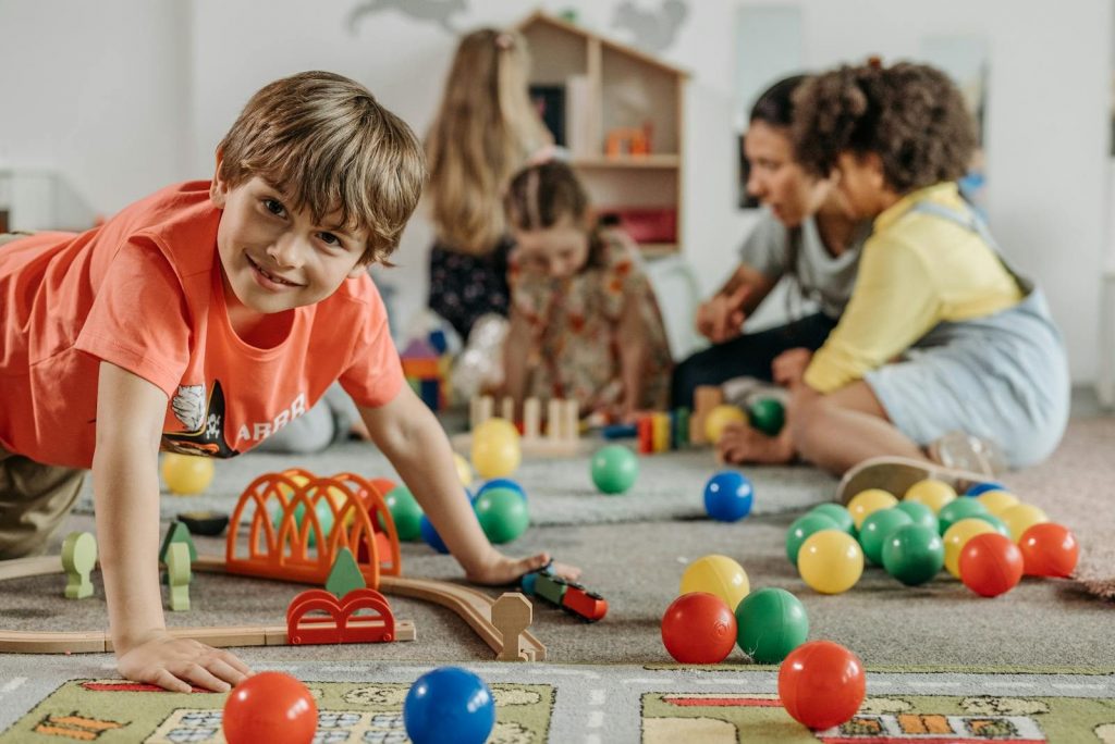 Happy young children playing together at Ohana childcare center near Highlands Ranch Colorado